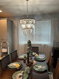 a dining room with a table and chairs