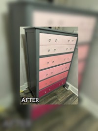 a pink and white dresser with pink drawers