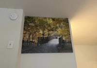 a picture of a bridge hanging on a wall