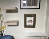 a shelf with a picture on it and a picture on it